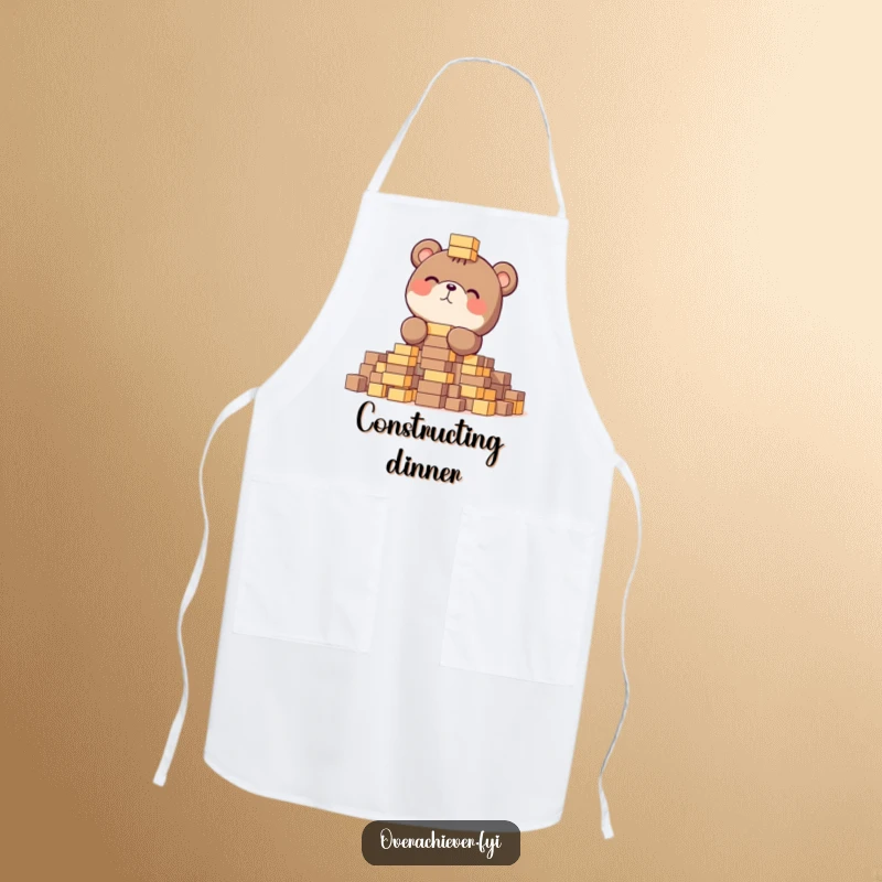 Funny apron with a focused bear gleefully stacking tiny blocks, ideal for a humorous and practical accessory.
