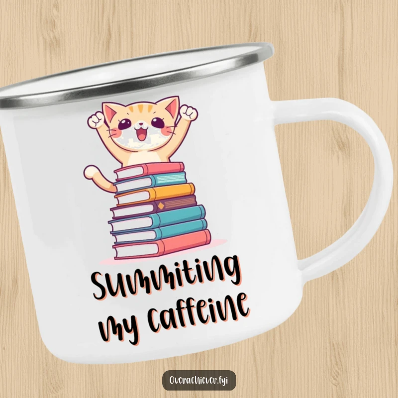 Funny camping mug featuring a triumphant cat character posing on a stack of books, perfect for outdoor reading enthusiasts.