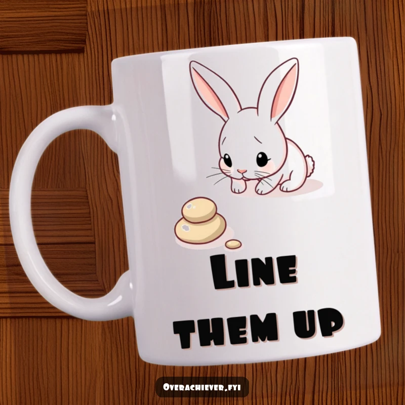 Funny Bunny Mug: A focused bunny carefully arranging pebbles in a perfect line, showcasing its precise and humorous nature.