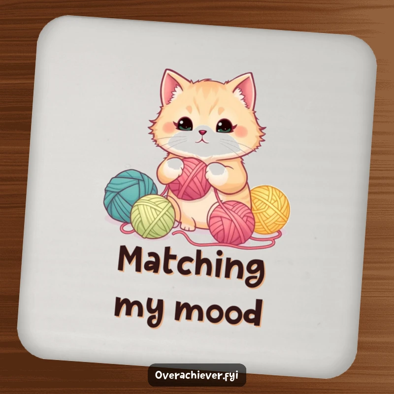 Funny fluffy cat meticulously organizing yarn balls by color gradient on a drink coaster, offering surface protection.