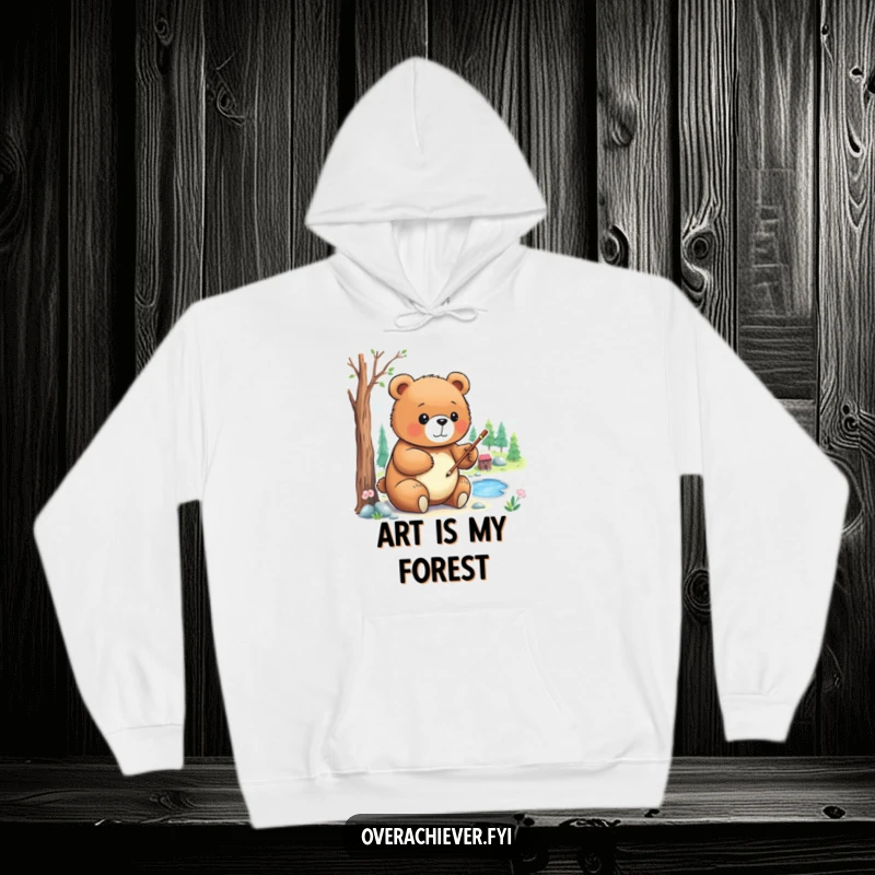 Funny Hoodie: A focused bear character with a paintbrush, carefully creating a detailed miniature landscape with great concentration.