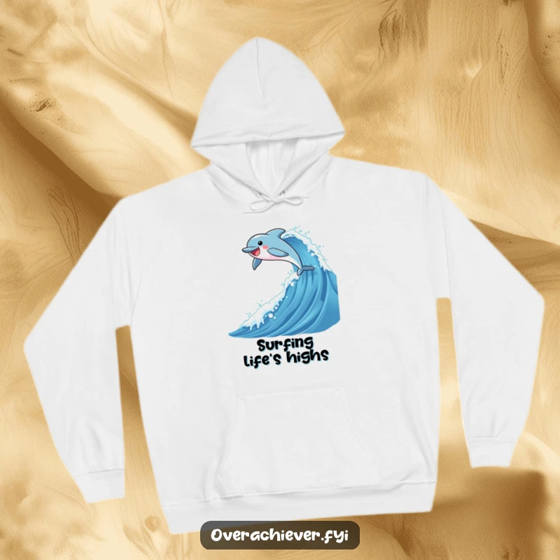 Funny hoodie featuring a dolphin character joyously leaping over a tremendously tall, shimmering ocean wave, capturing a sense of freedom.