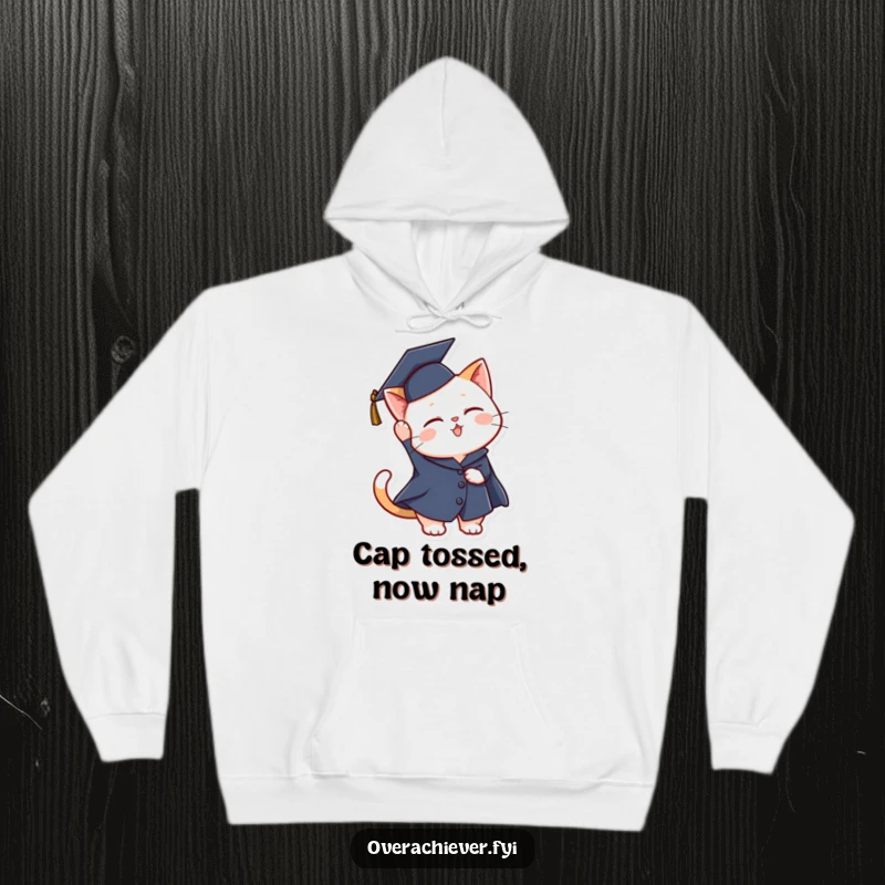 Funny graduation cat hoodie showing a joyful cat in a cap and gown celebrating its academic success with an airborne toss.