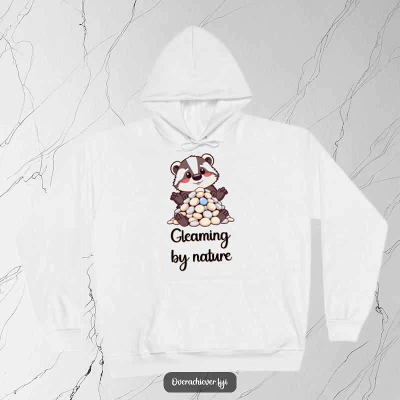 Funny hoodie with a proud badger displaying a meticulously organized pile of shiny pebbles, a humorous celebration of order, great funny gift.