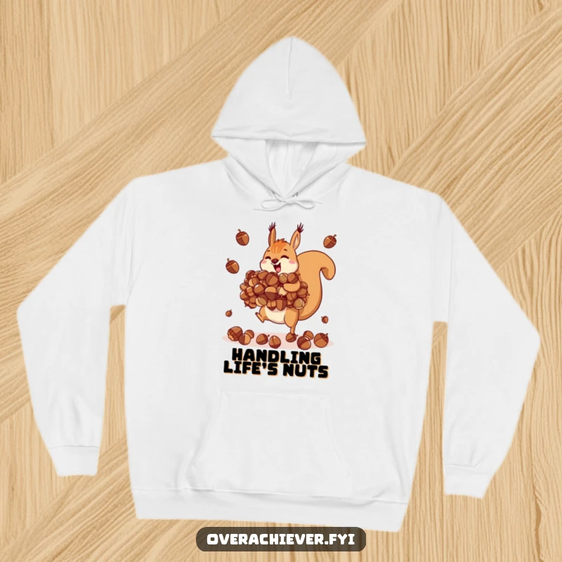 Funny motivated squirrel hoodie, juggling an impossibly large pile of acorns, cozy and prepared.