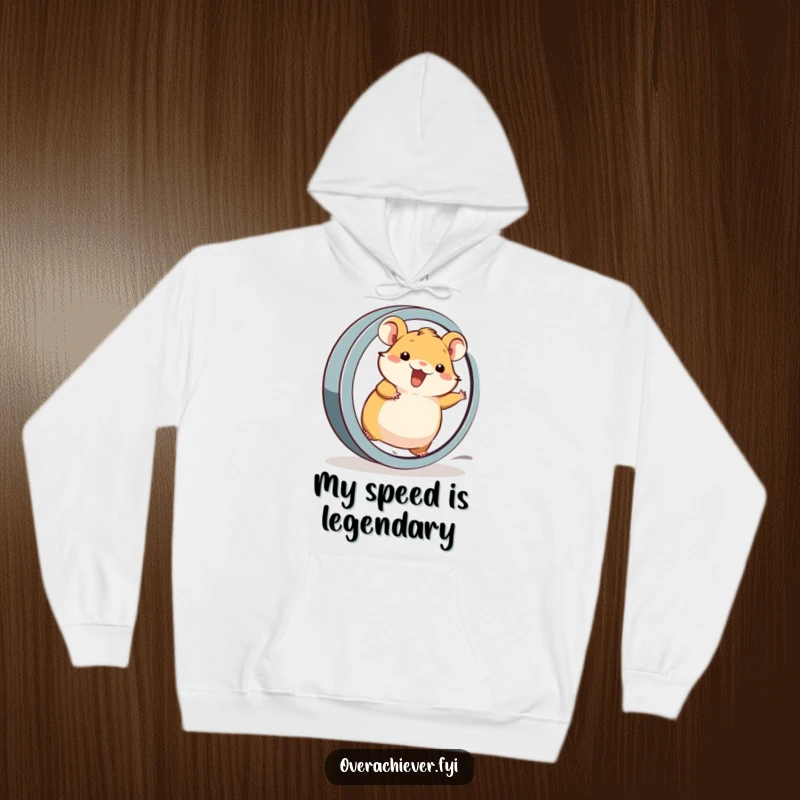 Funny Hoodie: A cheerful hamster character running at full speed on a large, oversized wheel, conveying pure energy.