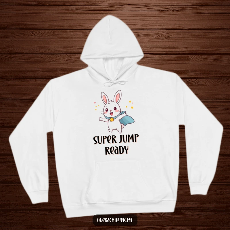 Funny happy rabbit character wearing a superhero cape, attempting to fly with sheer willpower, a warm and humorous hoodie.