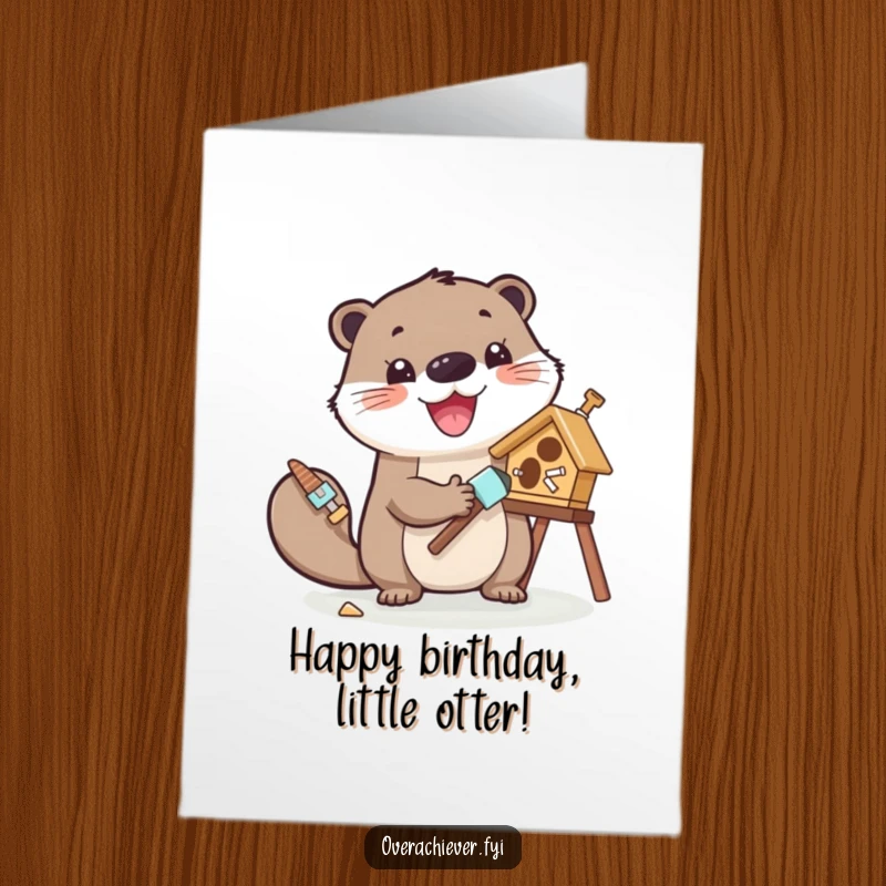 Funny Free Printable Birthday Card of a cheerful otter with tools, enthusiastically painting a tiny birdhouse.