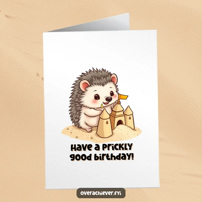 Funny Free Printable Birthday Card: A playful hedgehog meticulously building a tiny sandcastle on the beach, celebrating with artistic flair.