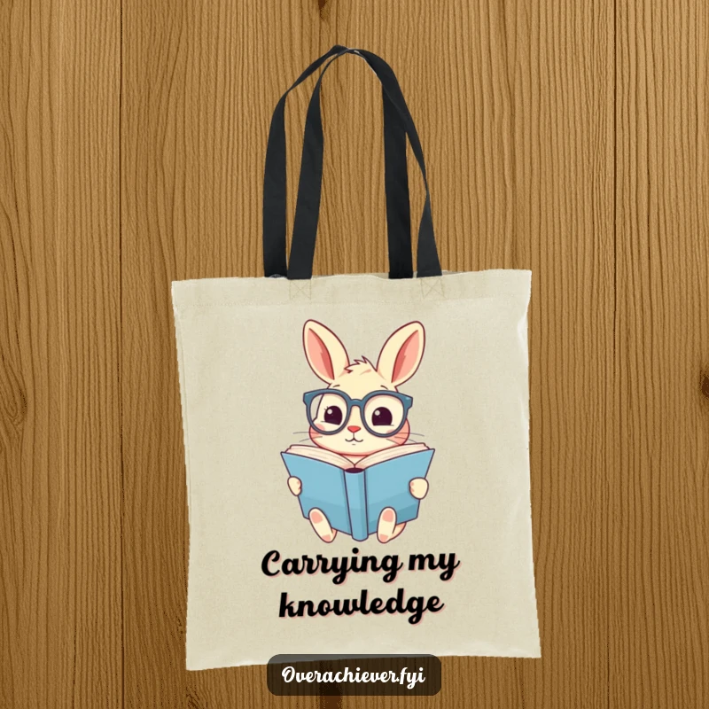 Funny tote bag featuring a cute rabbit in oversized spectacles, diligently reading a giant book, a charming accessory for readers.