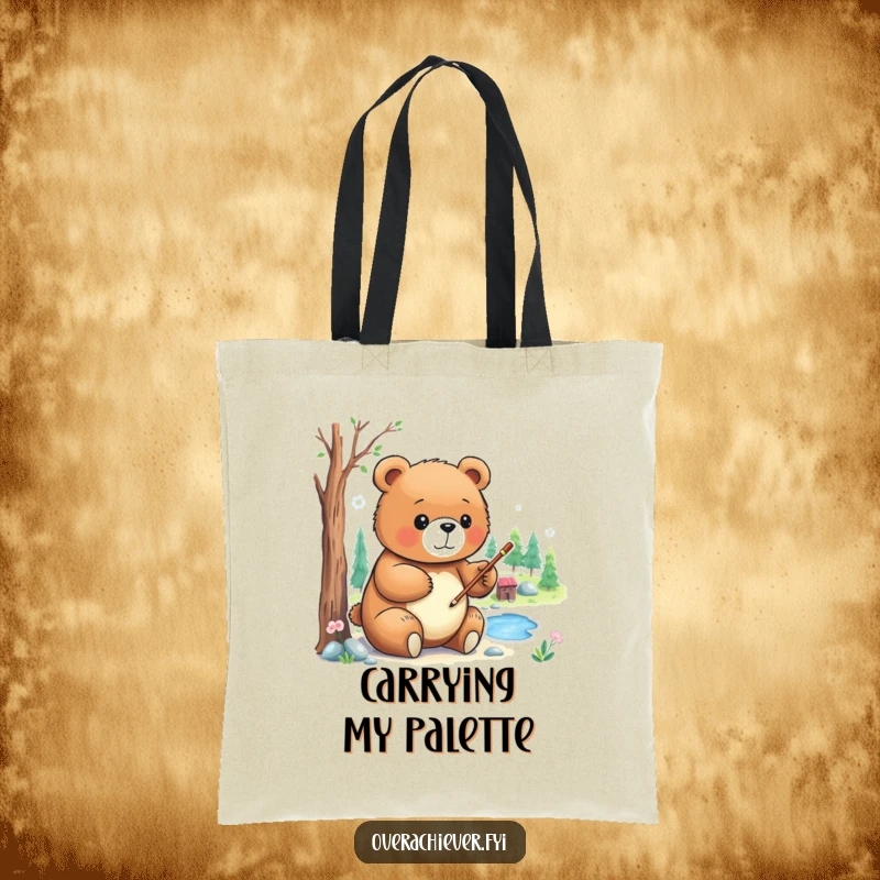 Funny Tote Bag: A focused bear character, paintbrush in hand, carefully painting a detailed miniature landscape, with artistic concentration.