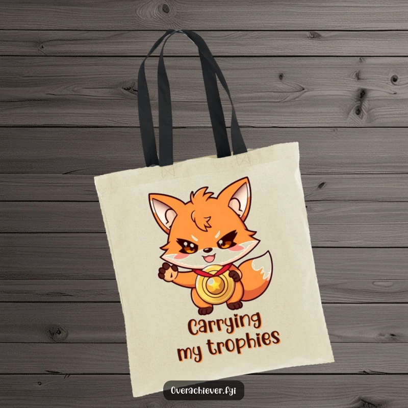 Funny driven fox tote bag, with a determined grin, presenting a shiny, oversized medal.