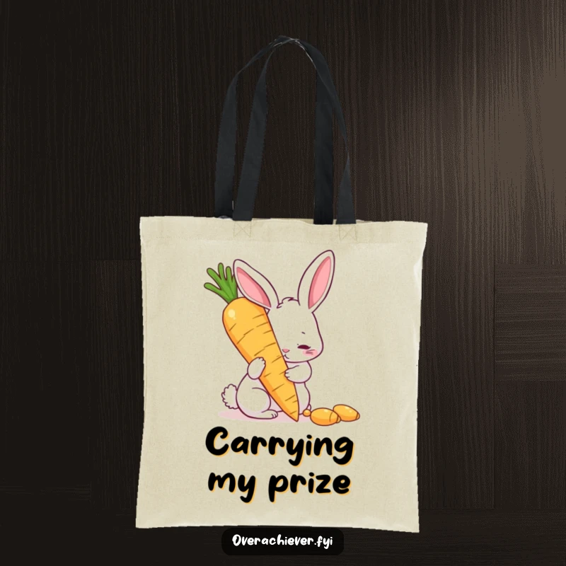 Funny tote bag with a determined rabbit polishing a giant golden carrot, a humorous accessory for carrying items and a perfect funny gift.