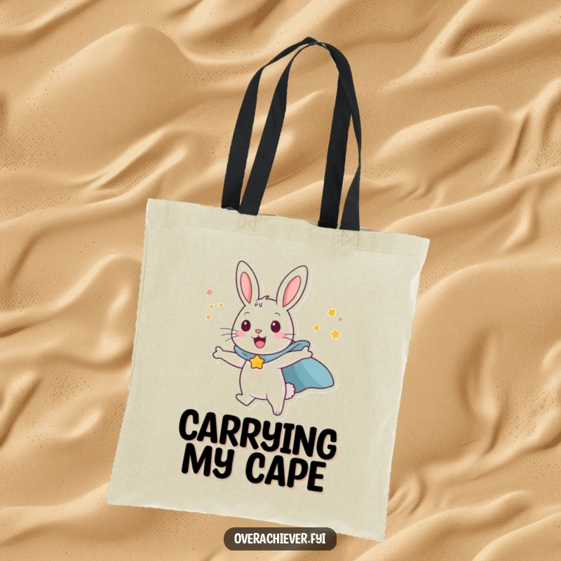 Funny happy rabbit character wearing a superhero cape, attempting to fly with sheer willpower, a practical and humorous tote bag.