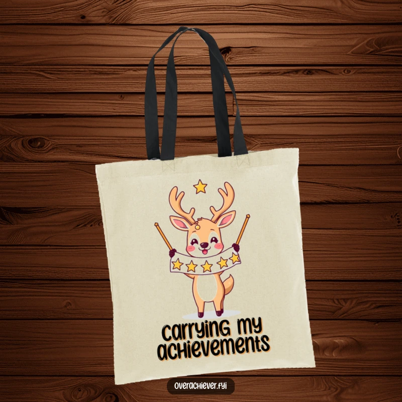 Funny tote bag design: A triumphant deer character holds a banner filled with many stars, representing success and ambition.